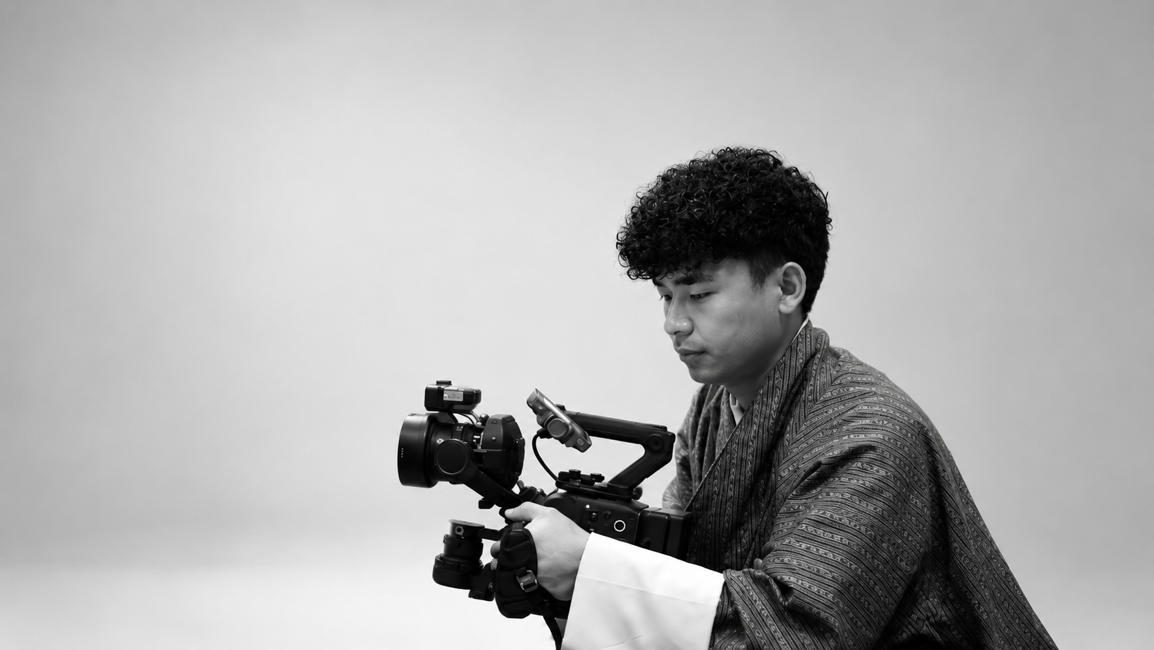 A Mid-Cloud Studio filmmaker operating a camera stabilizer